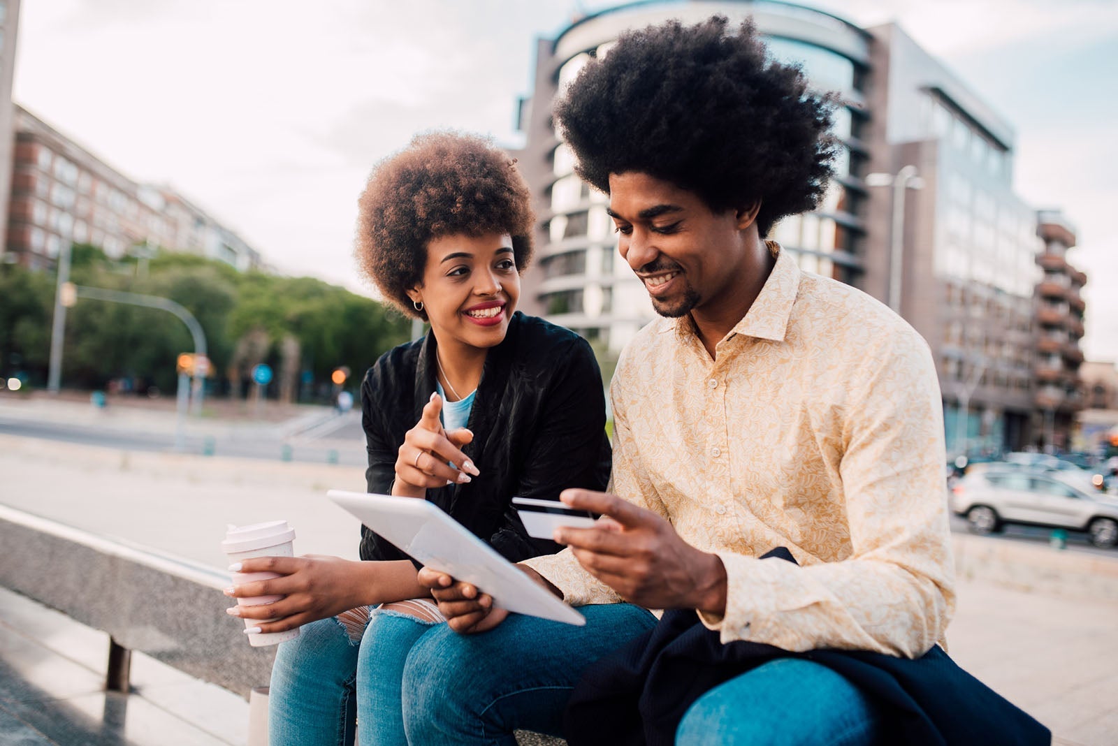 Young couple shopping online on the street