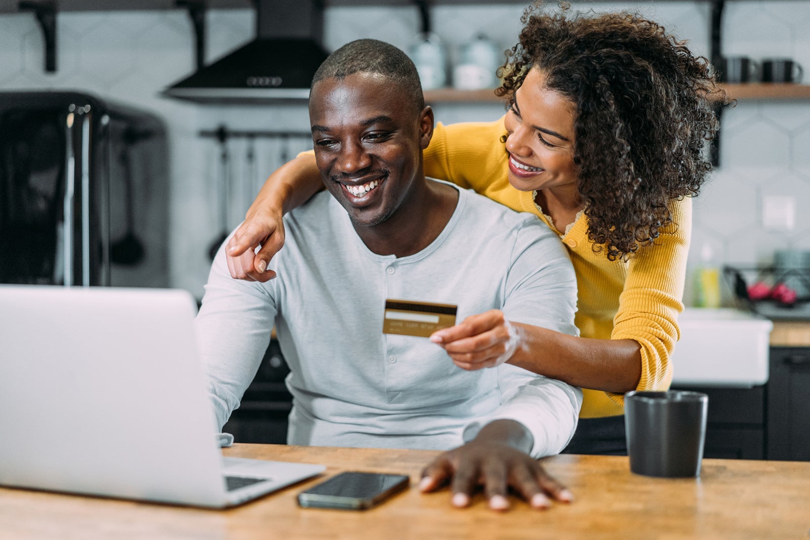 Lovely couple using laptop for online shopping.