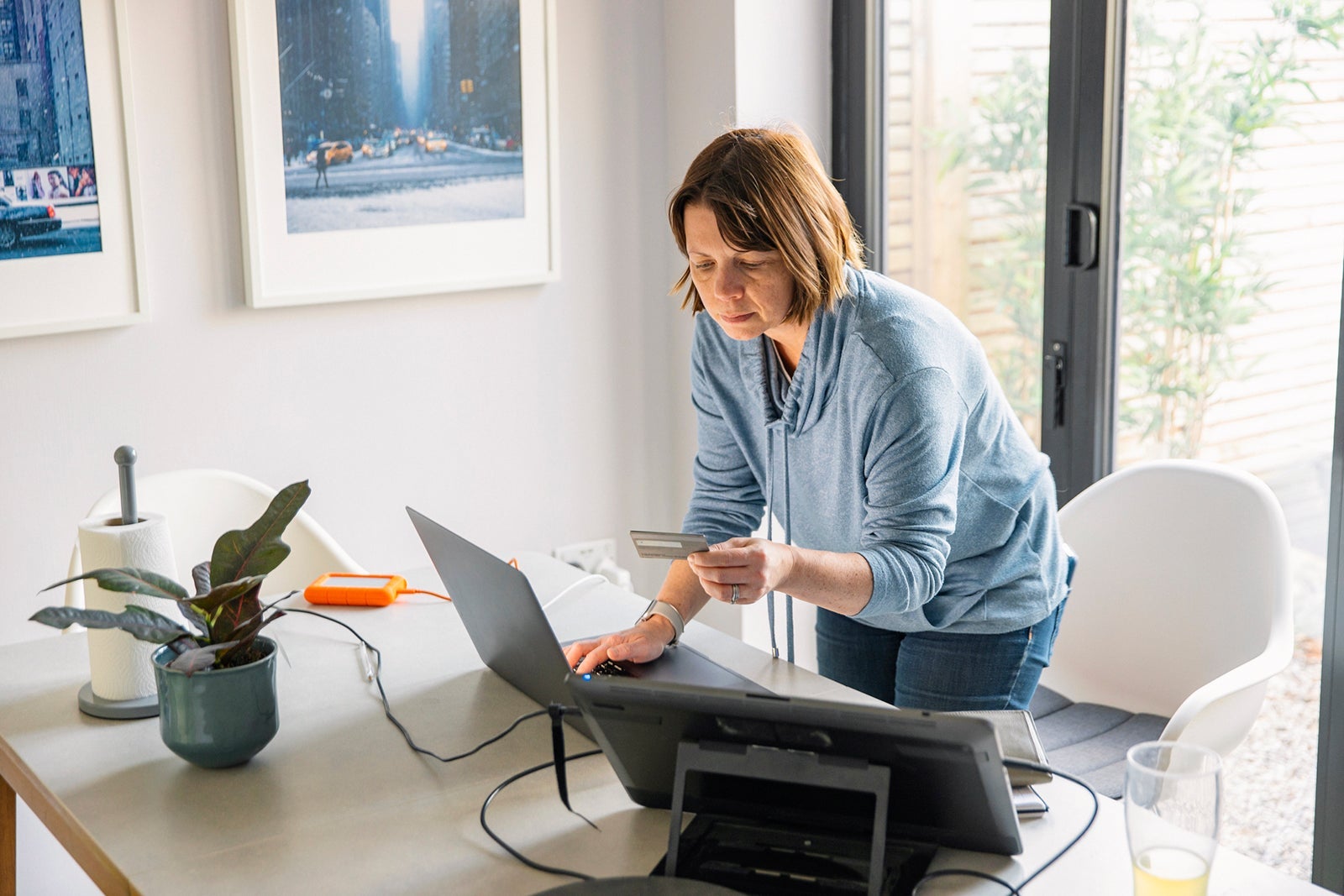 Woman making an online payment on her laptop using her credit card