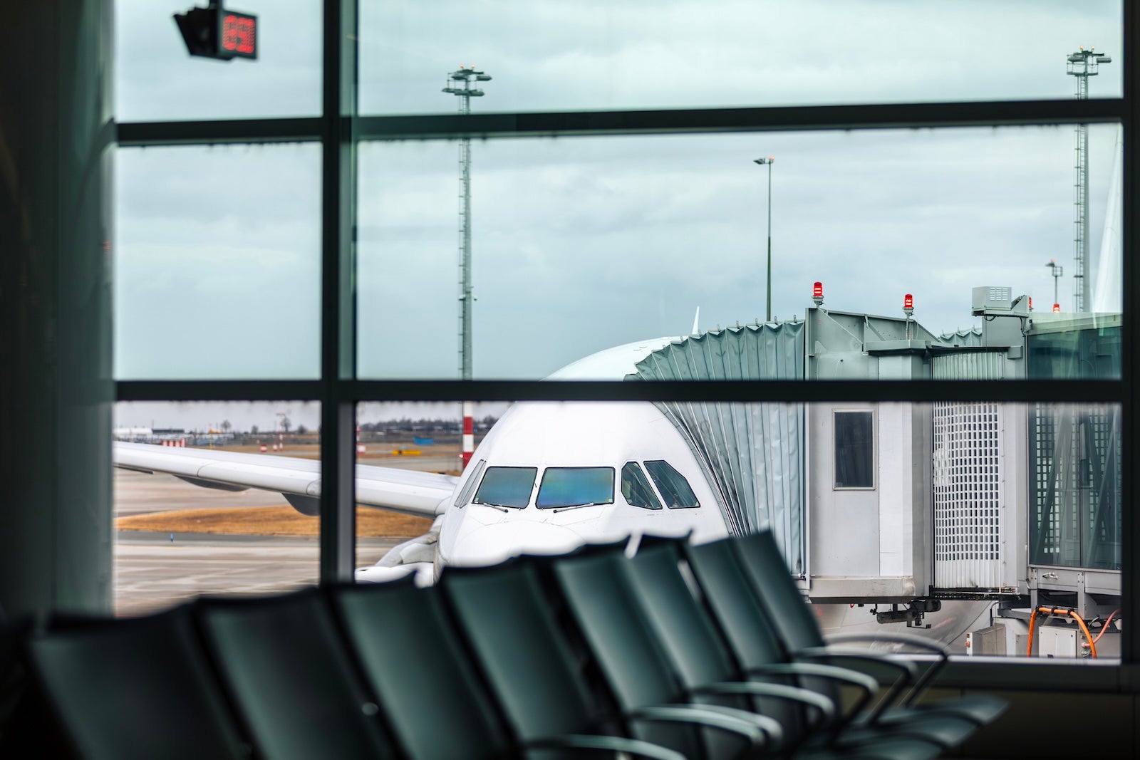 Airplane at gate with passenger boarding bridge