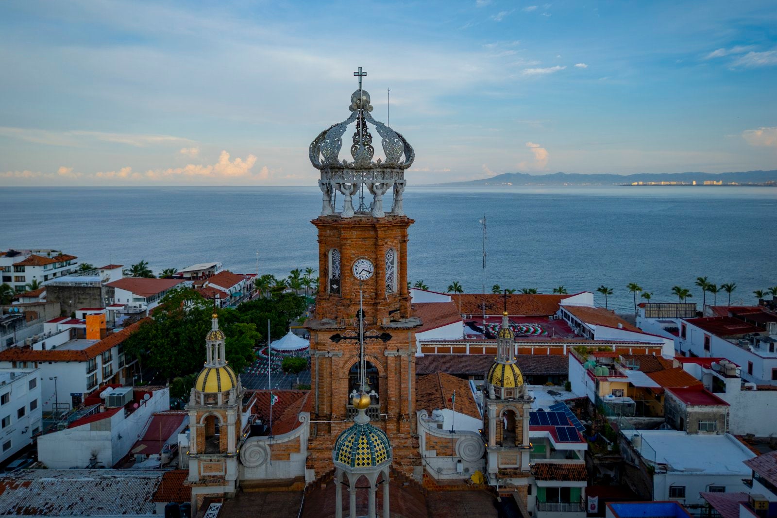 Aerial view of Puerto Vallarta Cathedral with Pacific Ocean backdrop